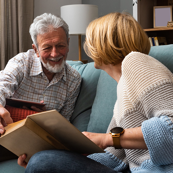 Middle age couple reading a book